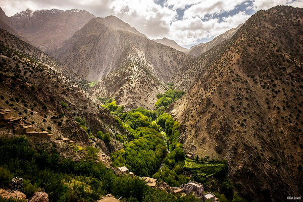 green valley with clouds