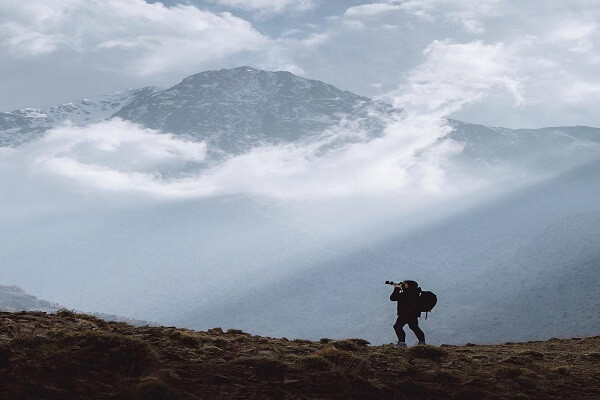 person and clouds in the background