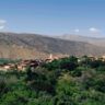 green valley with old buildings in atlas mountains