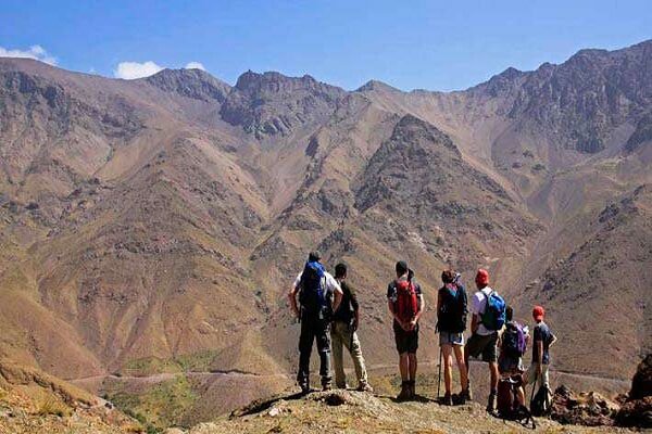 group of people looking at mountain view