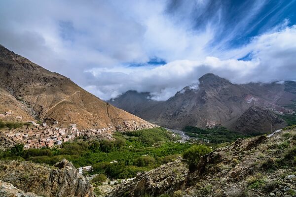 green valley and clouds in the mountains