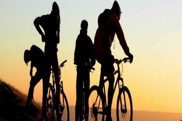 mtb in atlas mountains people with mountain bikes on sunset time