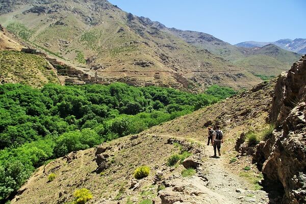 two people walking in river in morocco