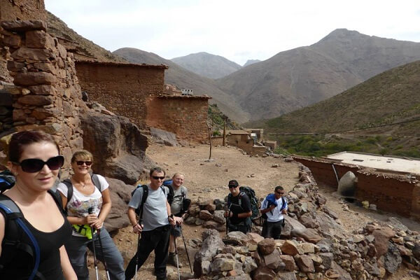 group of tourist walking in old village