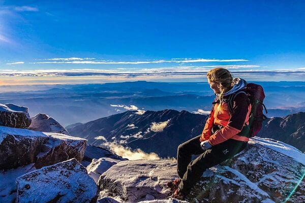 view from toubkal 1 lady setting on rock enjoying the view